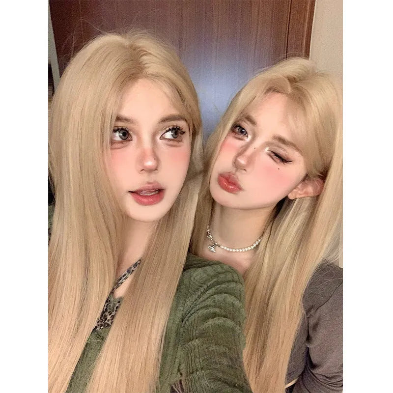 Full hair type women's long straight gray gold wig in milk tea blonde with hairnet on a mannequin
