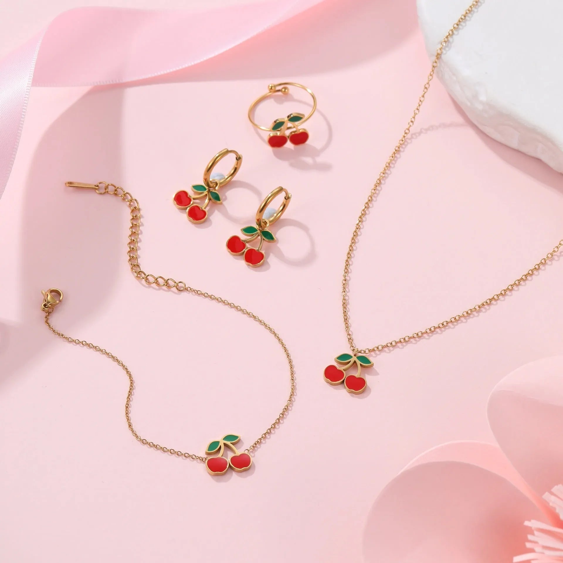 Complete cherry jewelry set with stainless steel necklace, bracelet, earrings, and ring with 18K gold electroplating.