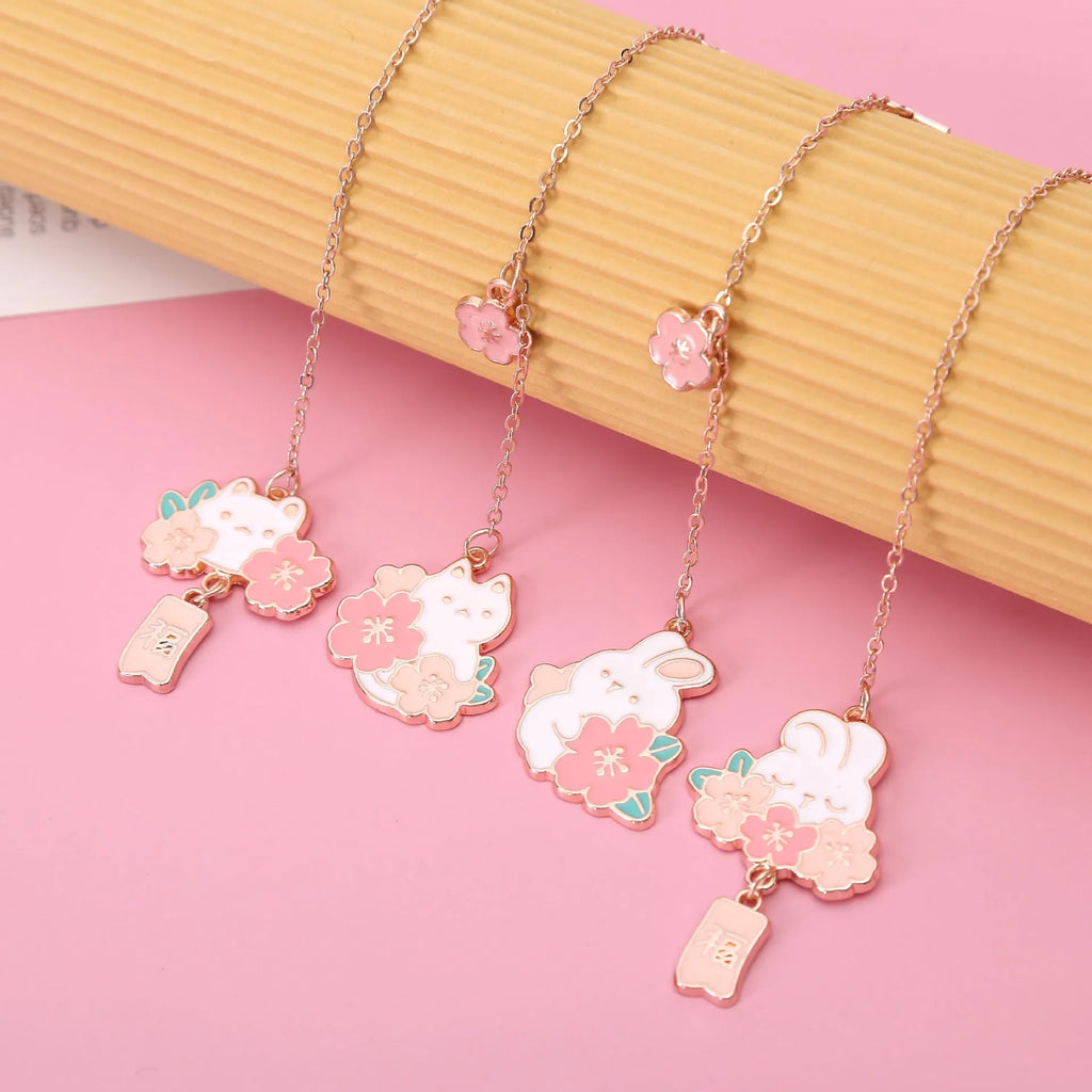 Metal pendant bookmark with engraved cherry blossom cat design, small decorative charm for book marking