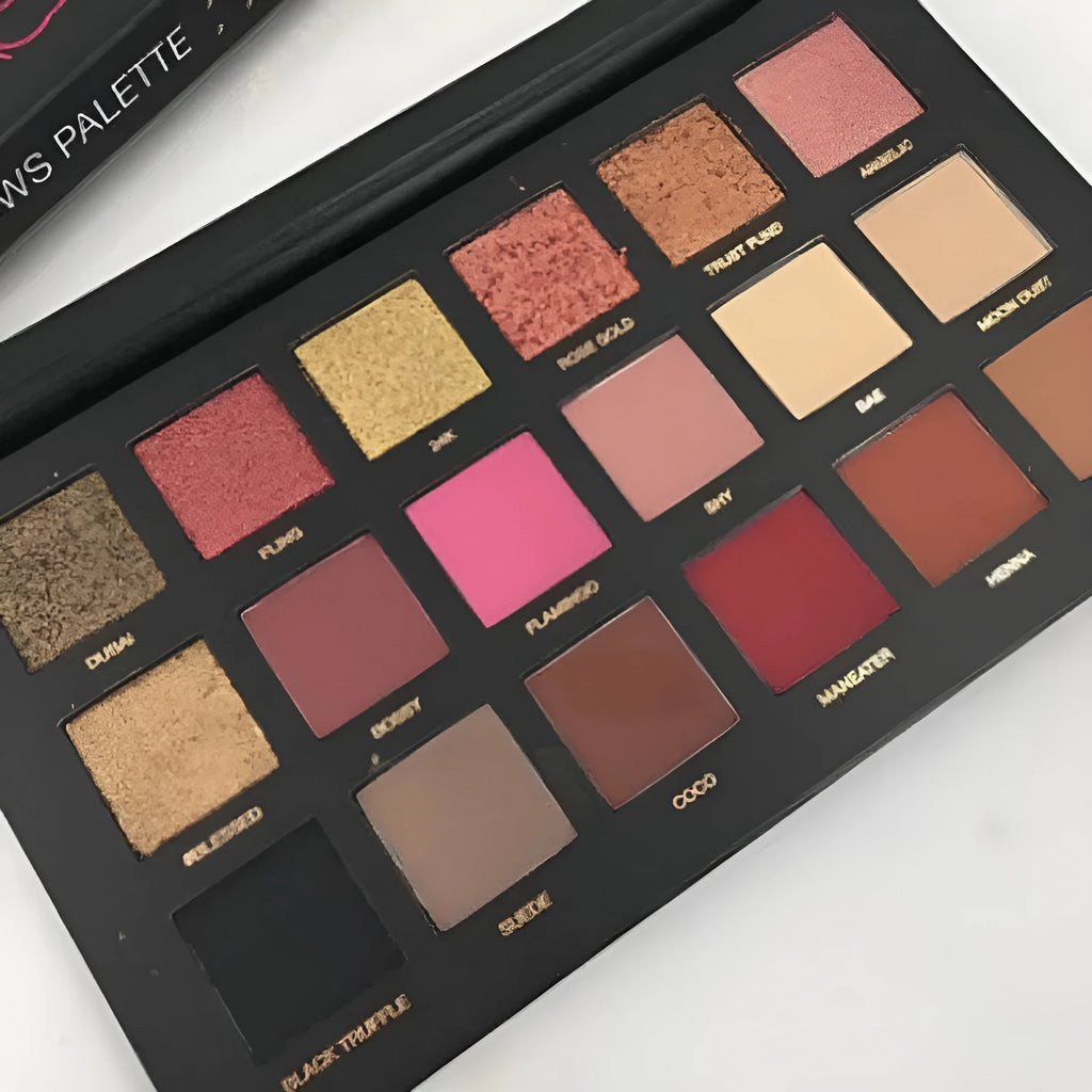 Desert Sun eye shadow palette open to show 12 warm neutral pans in matte and shimmer finishes with built-in mirror