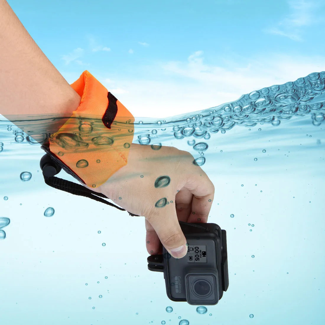 Orange nylon and foam camera buoyancy belt diving floating wrist strap on surface