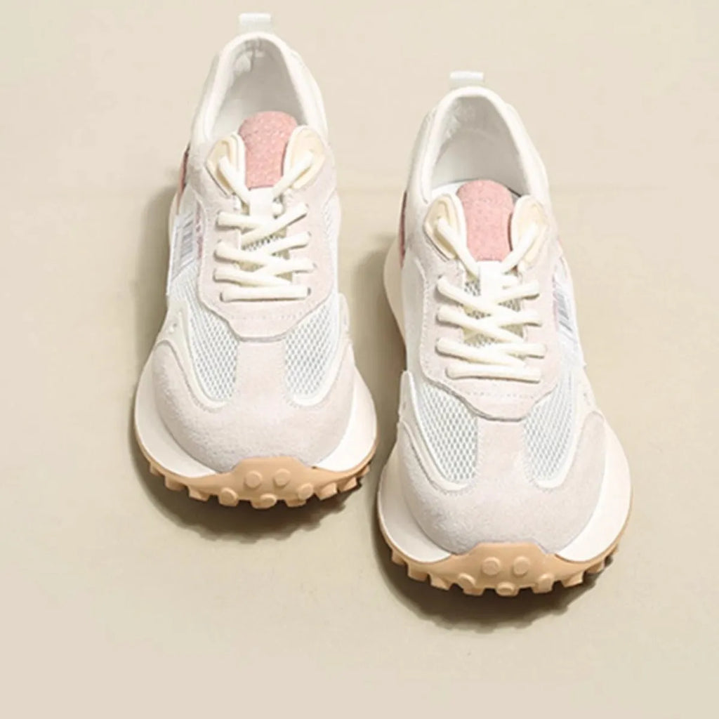 Women's grey and pink retro sneaker with low top design and round toe