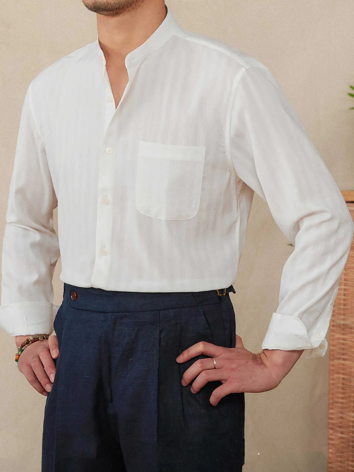 Blue and white striped seersucker long sleeve shirt with a loose lapel and baseball collar.