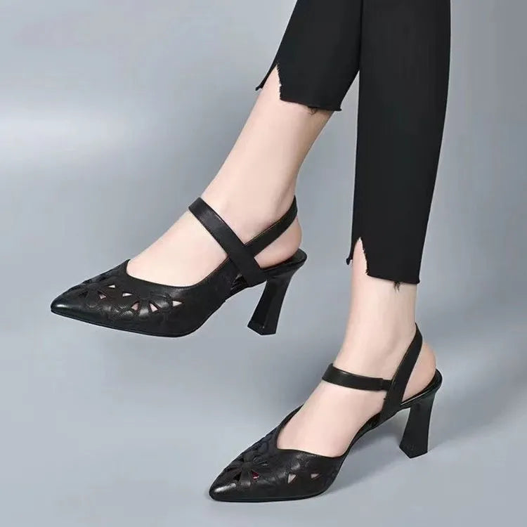 Women's red pointed toe backless sandals with high heel and hollowed toe box detail on a white background.