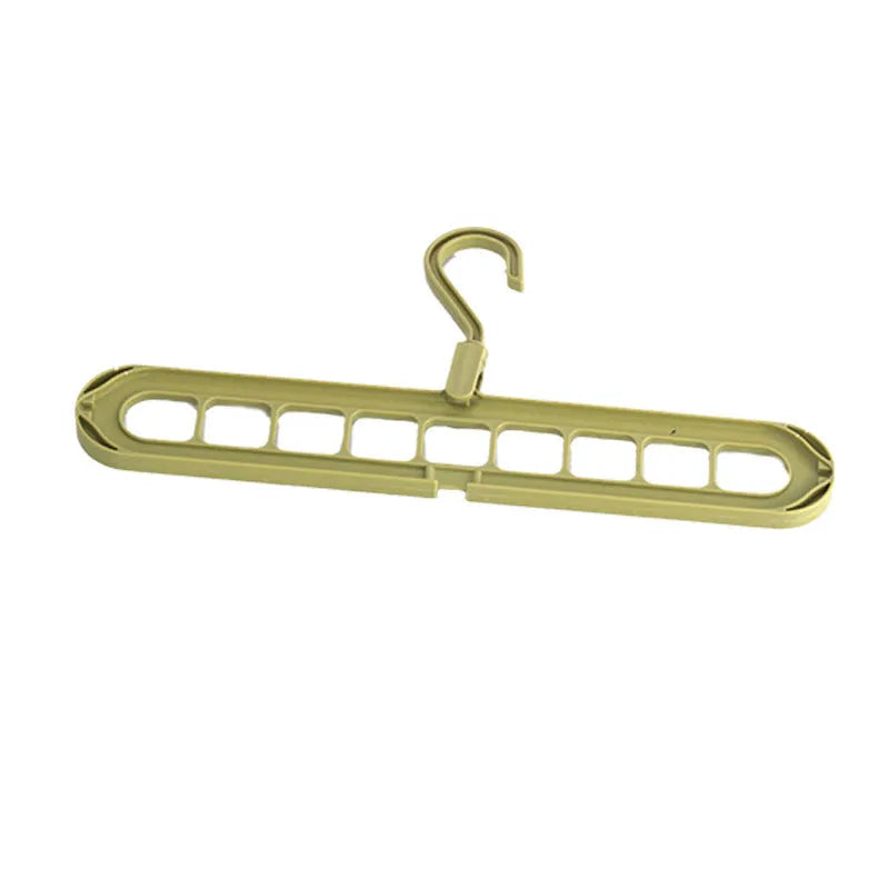 Green nine-hole plastic folding hanger for trousers and skirts showing multiple garment hanging points