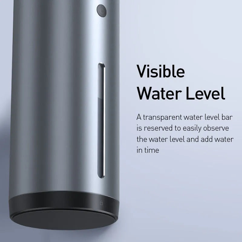 Black aluminium alloy car humidifier with USB cable and 12V car adapter plug on a desk.