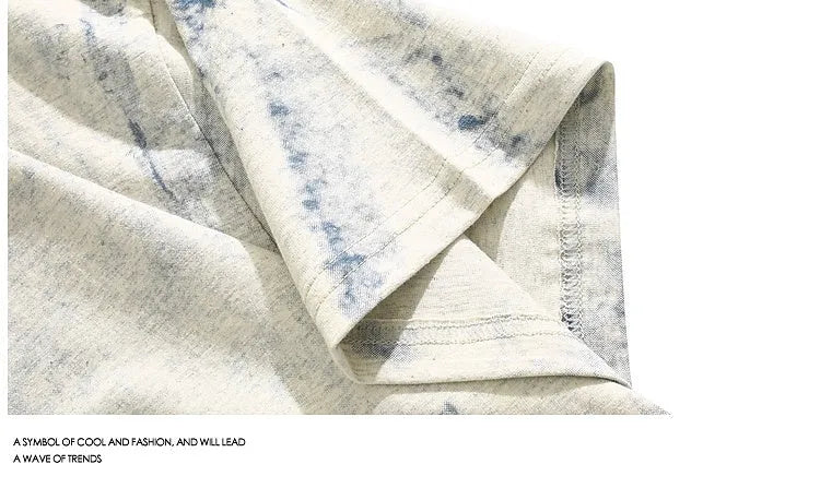 Grey loose fit t-shirt with an all-over tie dye print and short sleeves.