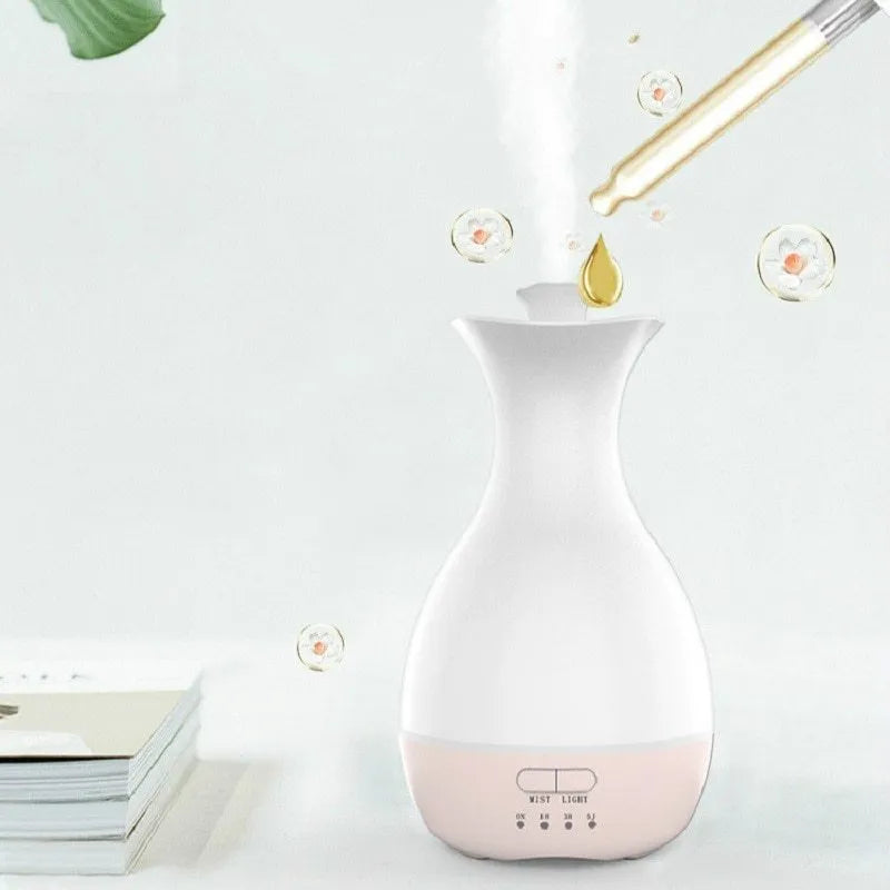 Pink and white ultrasonic aromatherapy humidifier with colourful LED night light and 200ml water tank