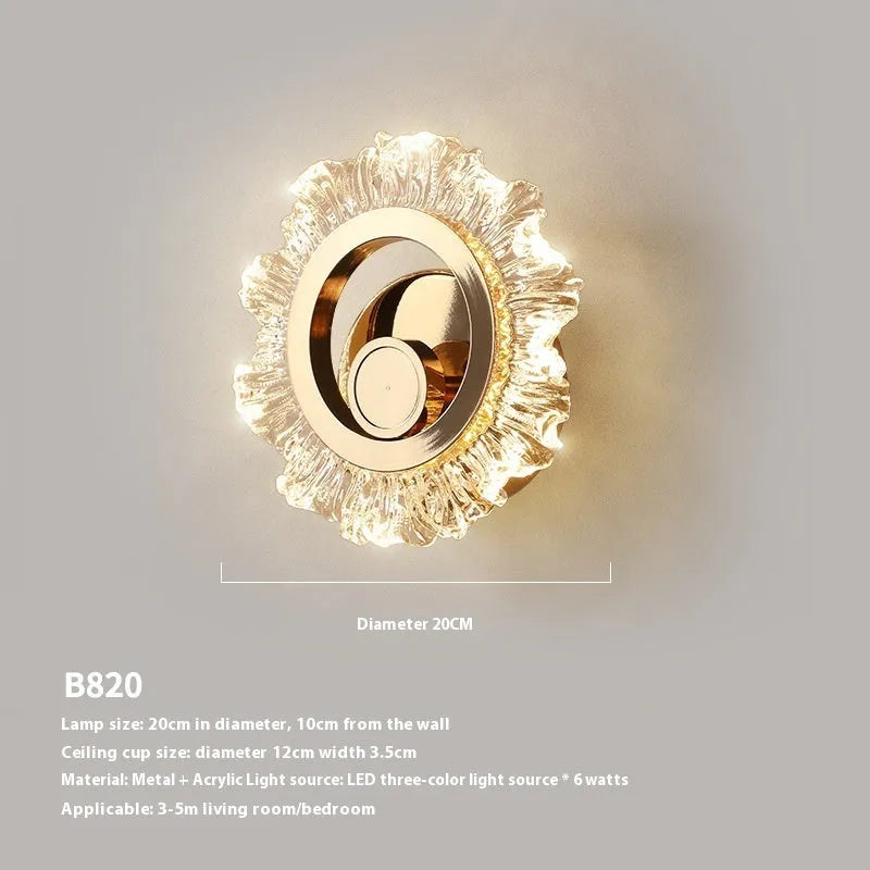 Modern minimalist white wall lamp with an acrylic shade mounted on a plain wall.