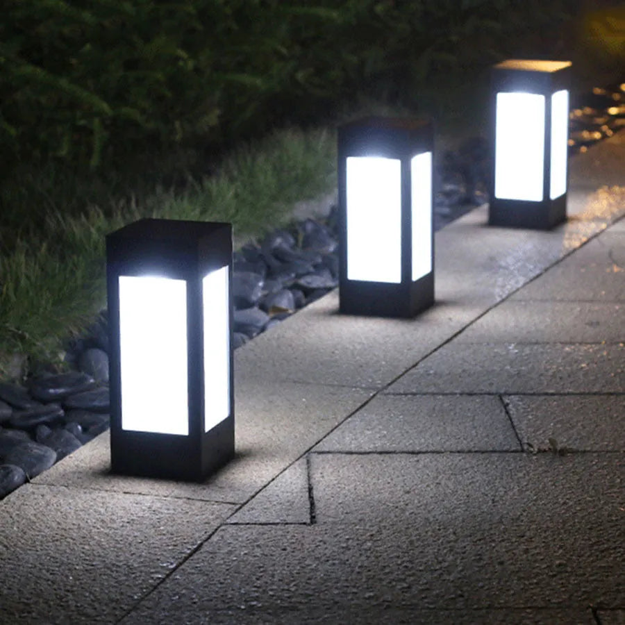 Solar-powered LED garden light in a UK garden setting, showing waterproof design and light emission.