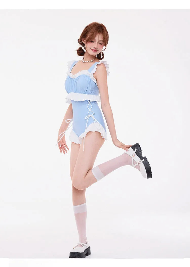 Light blue one-piece swimsuit with gathered front, high waist, and backless design.