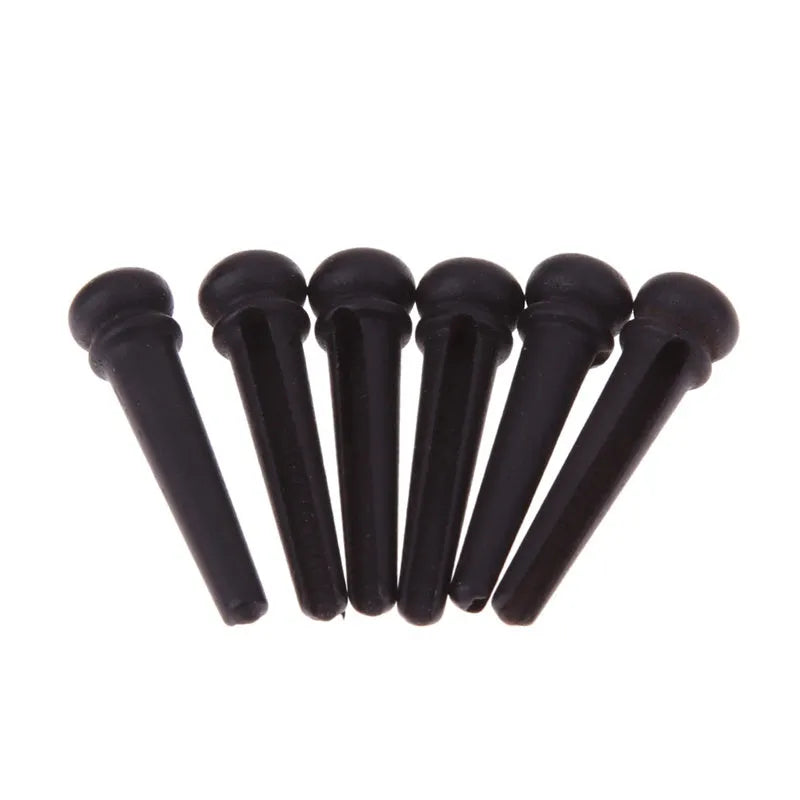 Six ebony folk guitar string nails with 5.3mm bayonet diameter in matt black finish