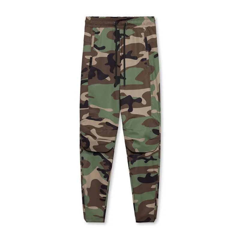 Men's loose-fit grey fitness trousers with elasticated ankle cuffs on a plain background.