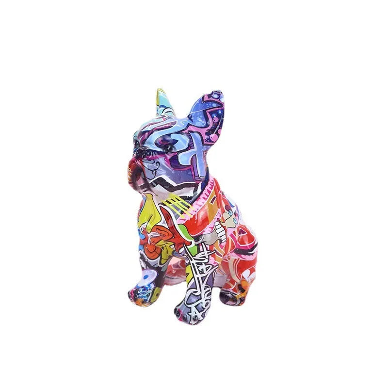 Graffiti coloured solid resin French bulldog statue on a wooden surface.