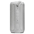 Outdoor portable Bluetooth speaker in camouflage colour with buttons for volume, playback, and mode selection.