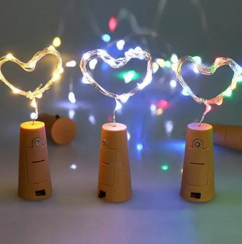 Silver copper wire LED string lights wrapped around wine bottle with 20 white LEDs