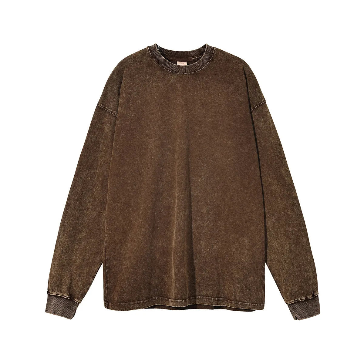 Man wearing a loose-fit batik print long sleeve cotton pullover top in a vintage washed colour.