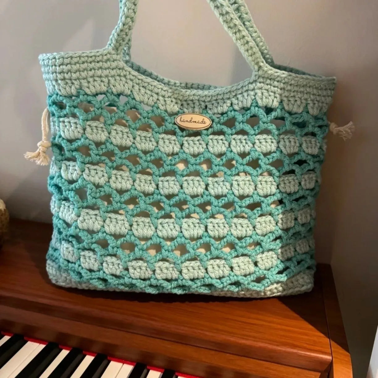 Handwoven natural wool summer bag with floral patterns in six style options