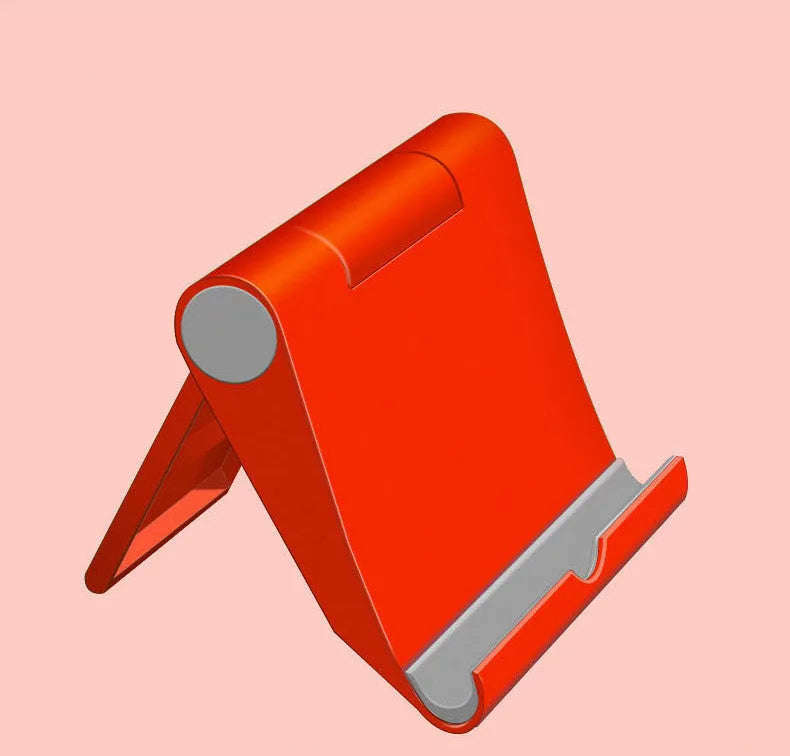 Black PE folding tablet stand holding a mobile phone at an adjustable viewing angle on a wooden desk.