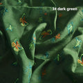 Roll of beige, grass green, and dark green 100% ramie fabric showing its texture and 140cm width.