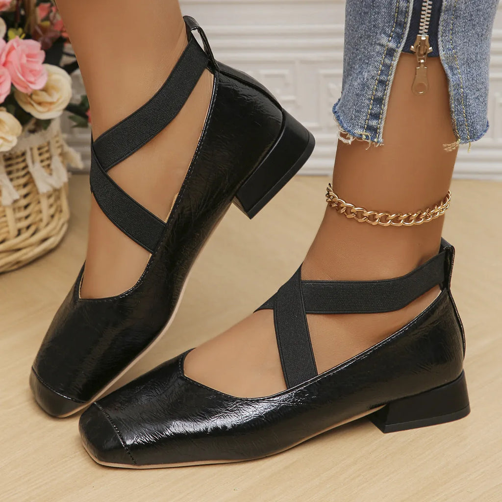 Gold women's slip-on evening pumps with skirt detail, square toe, and low rubber heel