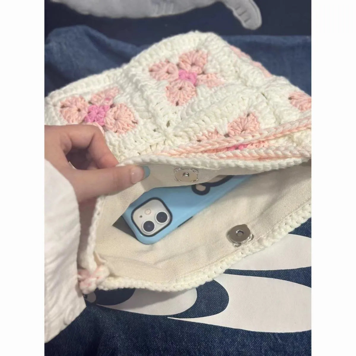 Handmade cotton crochet handbag with cherry blossom design and magnetic buckle closure