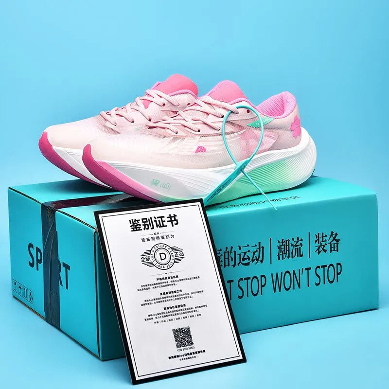 Low-top racing sneaker in glacier colour with carbon plate sole, PU mesh upper, and lace-up closure.