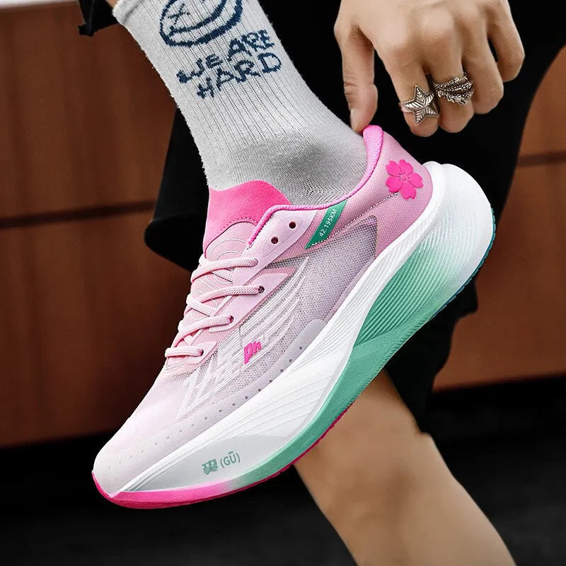 Low-top racing sneaker in glacier colour with carbon plate sole, PU mesh upper, and lace-up closure.