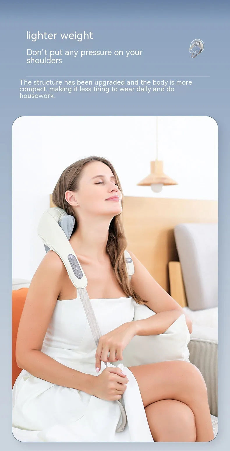 Beige neck massage pillow with six massage heads and wireless remote control on a table