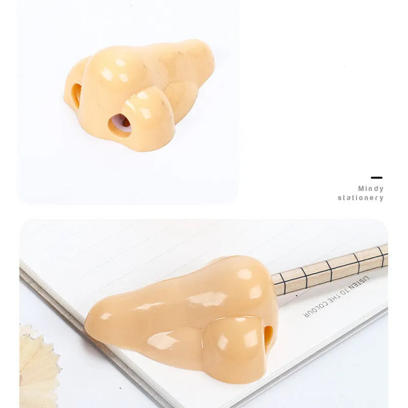 Flesh colour geometry-shaped plastic pencil sharpener for manual use.