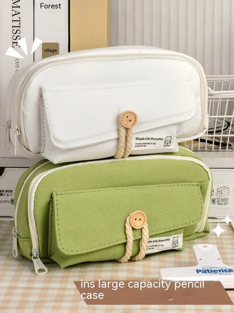 Green canvas button pencil case showing large capacity for pens in Korean style design.