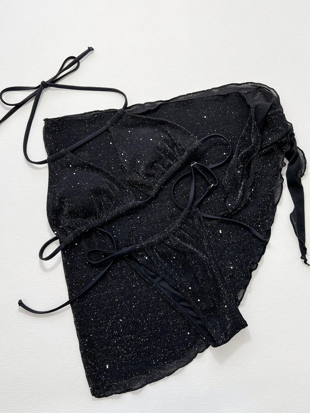 Black women's three-piece fission bikini set with top and shorts on a mannequin.