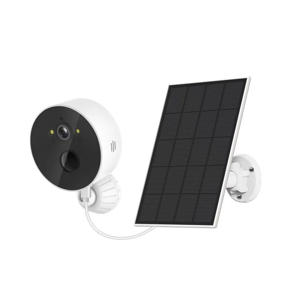 Solar-powered outdoor security camera with solar panel on grass
