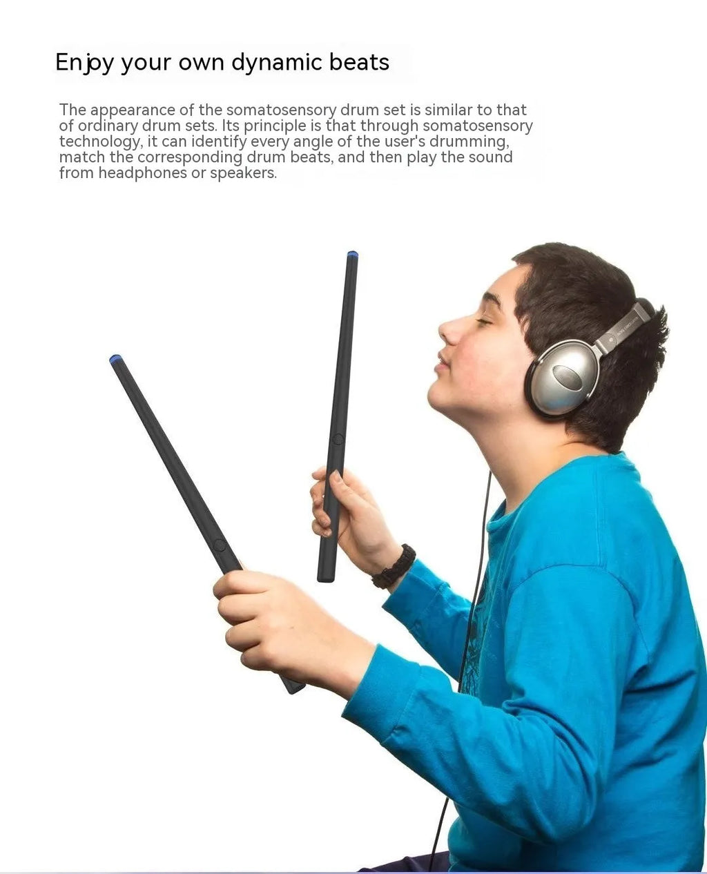 Black somatosensory air drum kit with wireless host unit, two drumsticks, and charging accessories on dark background