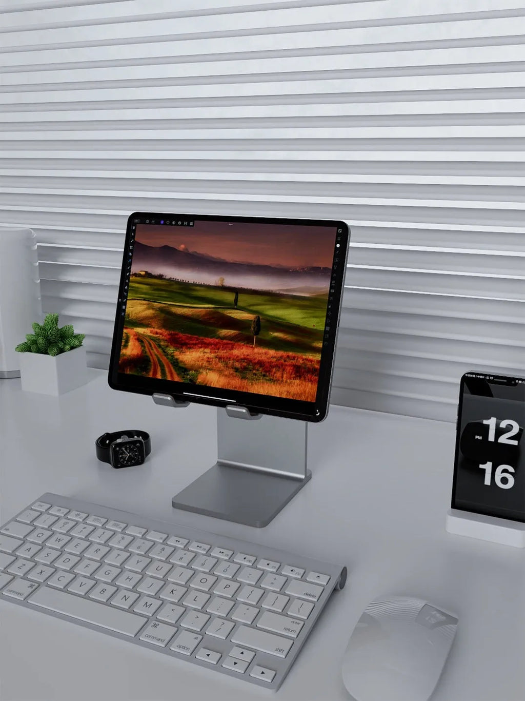 Silver aluminium alloy adjustable desktop stand with phone holder on a desk
