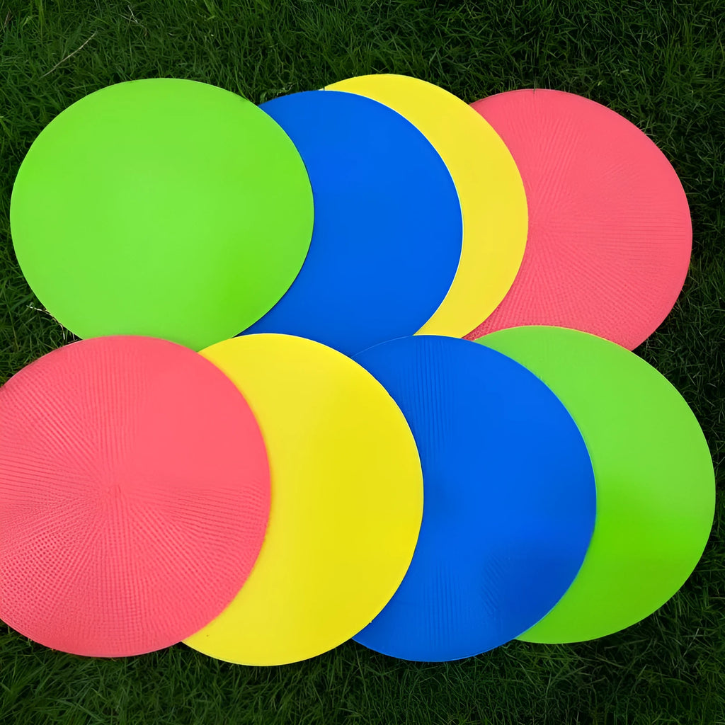 Yellow football training marker disc on grass field showing 23cm diameter flat design