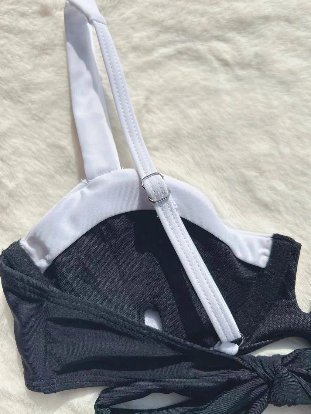 Black low waist bikini swimsuit for women with stitching split details on briefs-style bottoms