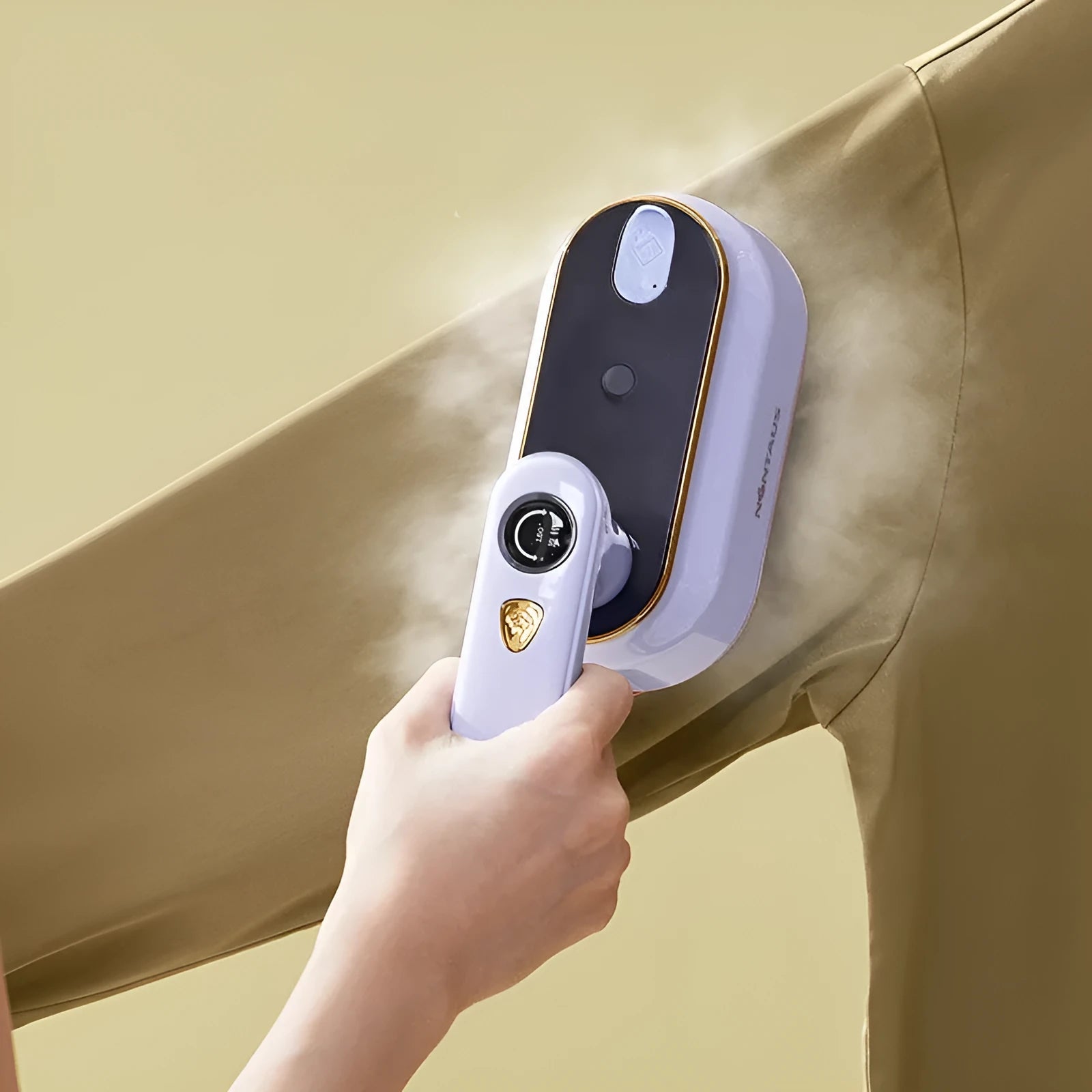 Milky white foldable travel iron with ceramic plate and worldwide voltage compatibility