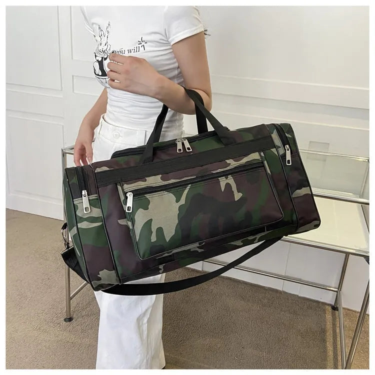 Camouflage coloured waterproof luggage bag with large capacity for travel.