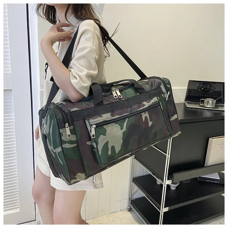 Camouflage coloured waterproof luggage bag with large capacity for travel.