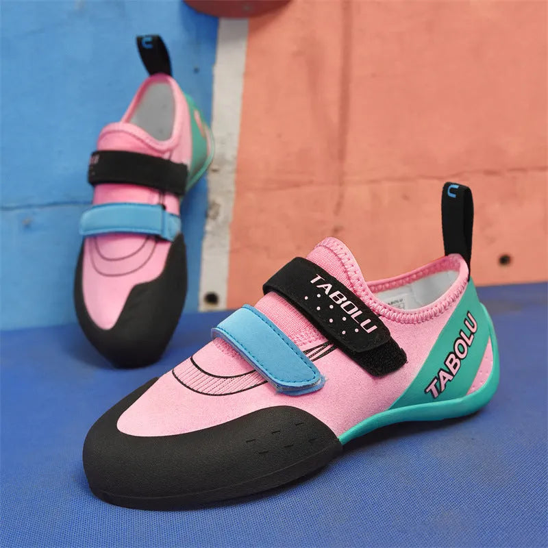 Men's and women's beginner rock climbing shoes with Velcro straps and coloured trim.