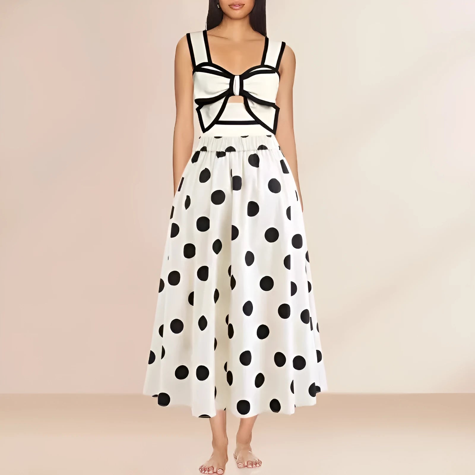 Women's black and white one-piece swimsuit with round skirt and bow detail