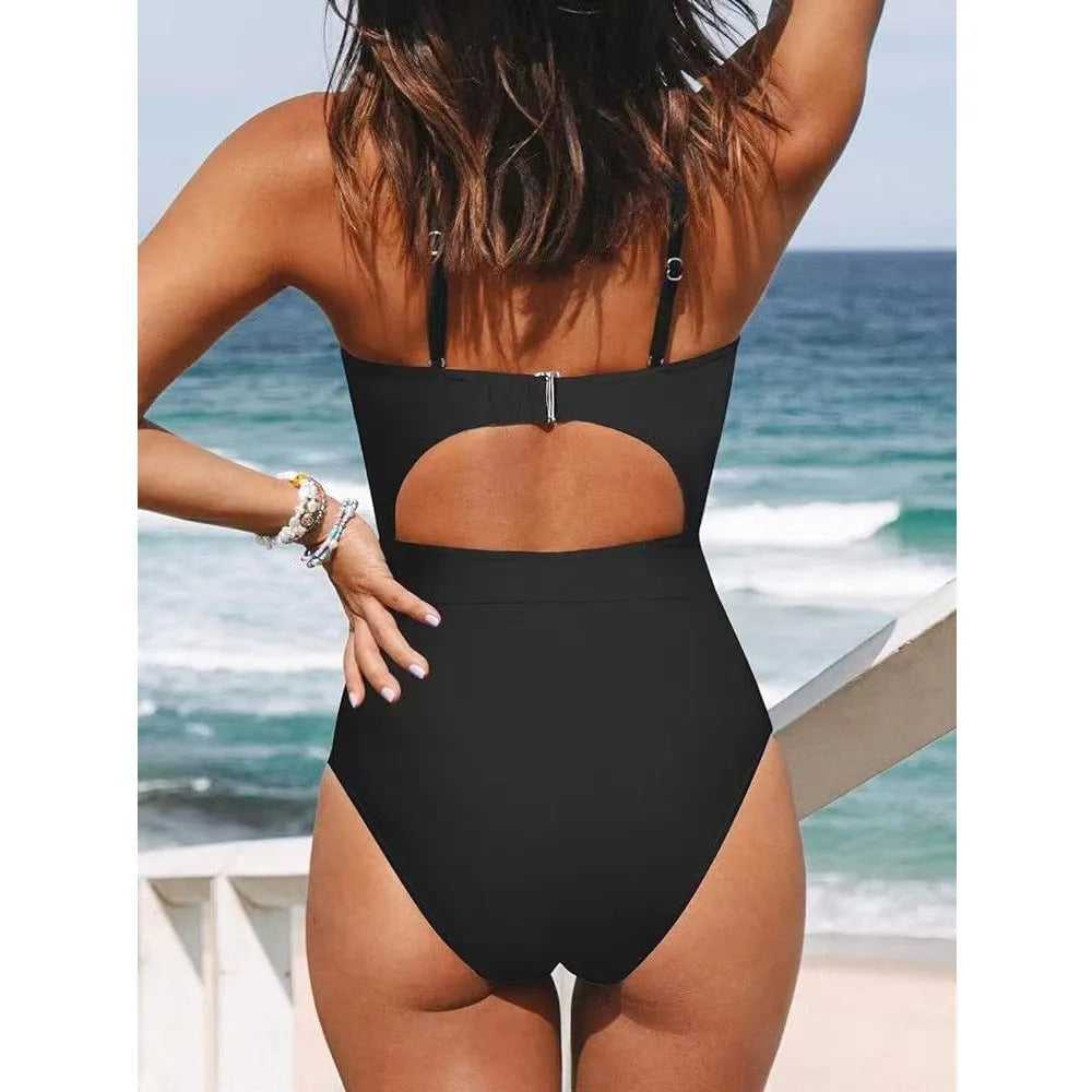 Women's backless solid colour one-piece swimsuit on a hanger