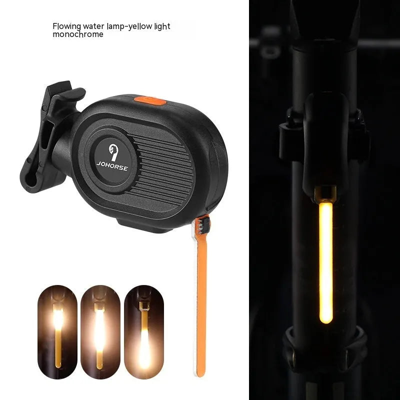 USB rechargeable bicycle tail light with blue waterfall or running water lighting effect on a bike seat post.