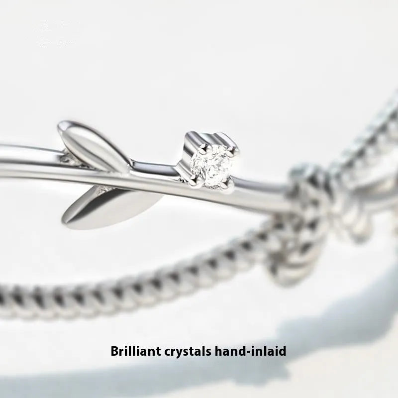 Copper tree branch sprout bracelet with cross twisted design in white gold electroplated finish