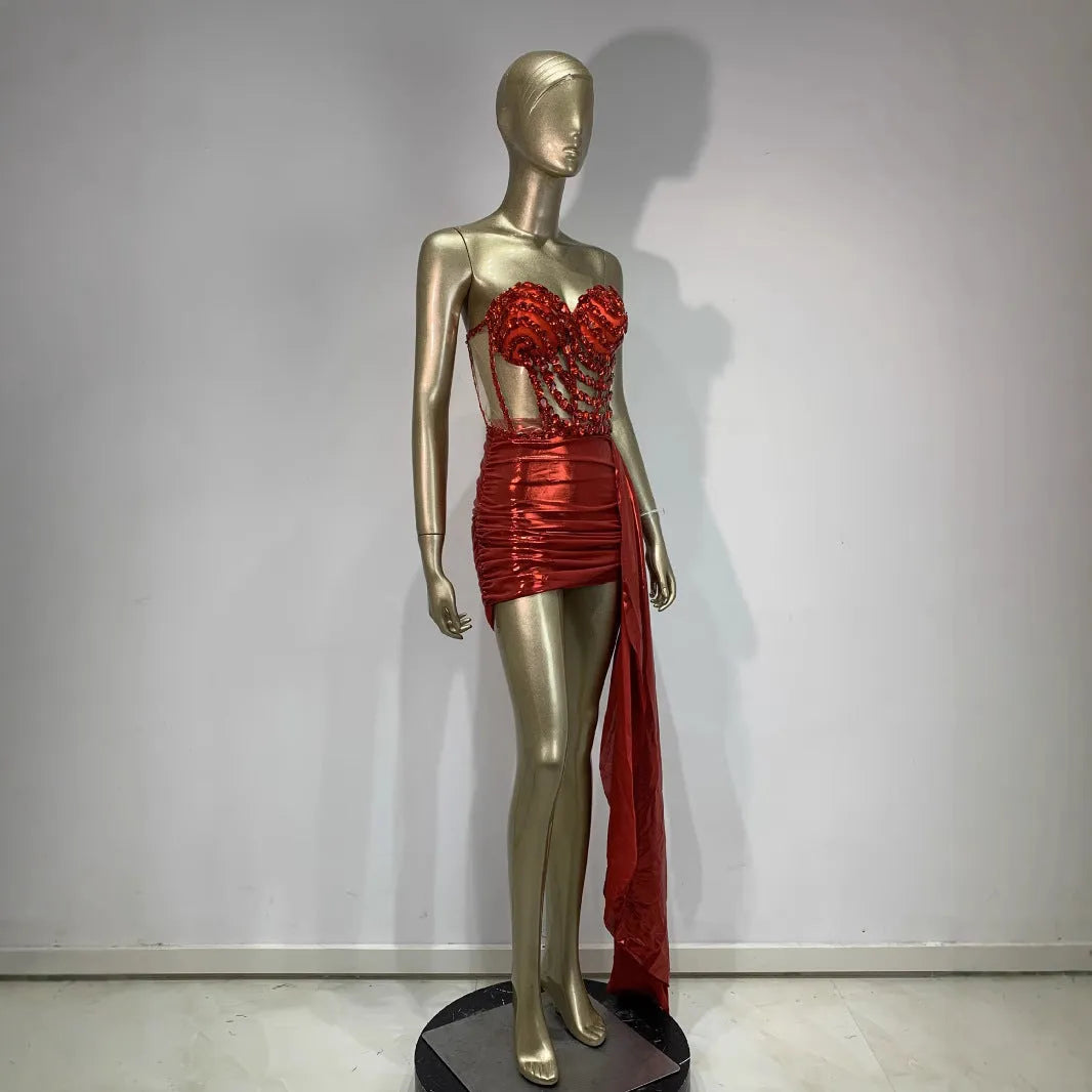 Red women's spandex skirt suit with see-through hollow mesh panels for stage performance.