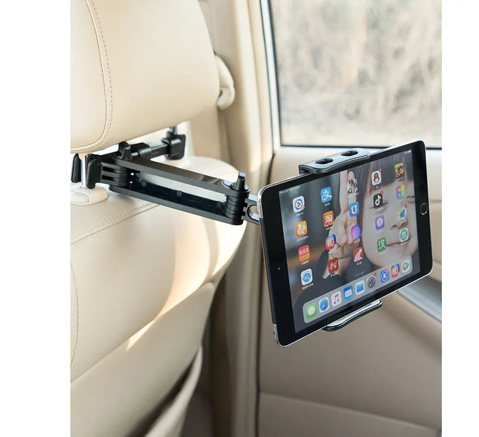 Black universal car phone holder mounted on vehicle rear seat base holding tablet