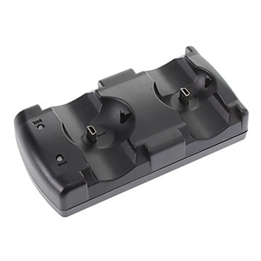 Black PS3 dual charging dock with two wireless controllers placed upright on charging pins, connected via USB cable.