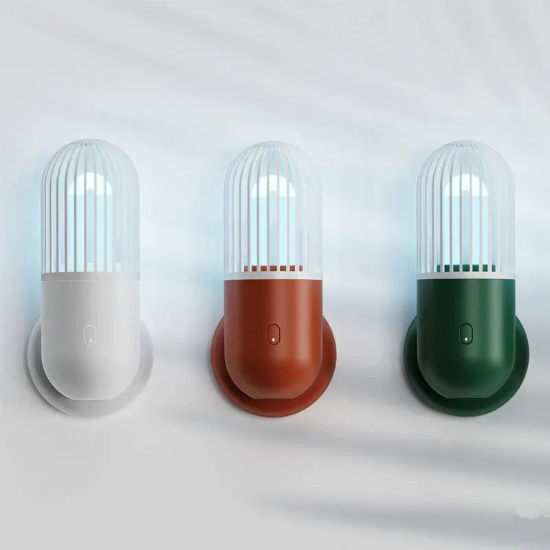Portable capsule UVC disinfection lamp in four colours with dimensions 64x64x148mm