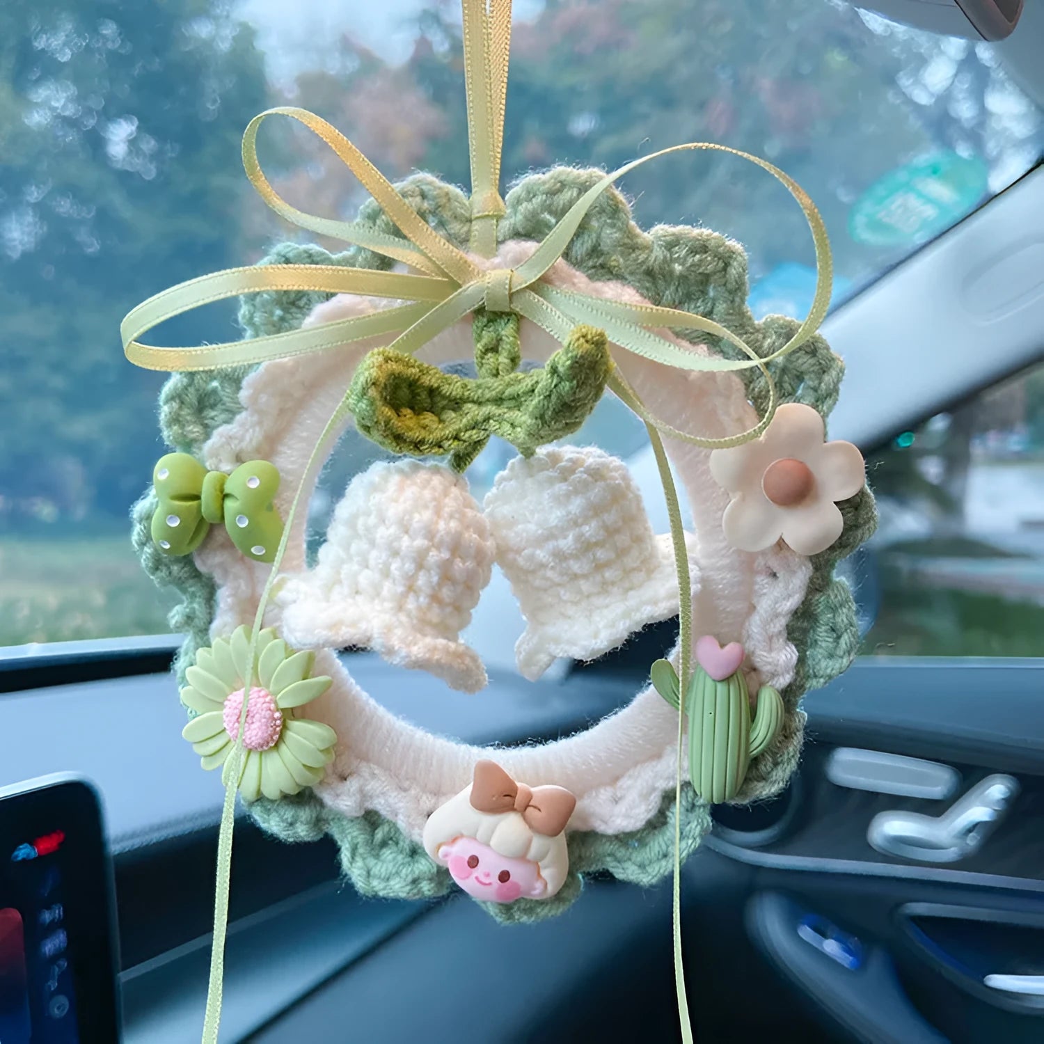 Handwoven wool bell orchid car pendant in green, pink, purple, or yellow colours.